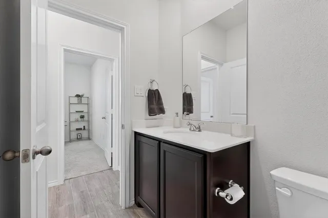 a bathroom with a sink and mirror