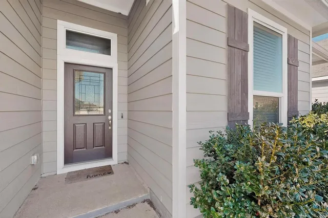 front view of a house with a small garden