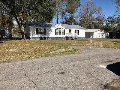 23921 Ermine Road Astor, FL 32102 - Photo 1 of 1 a front view of a house with a yard