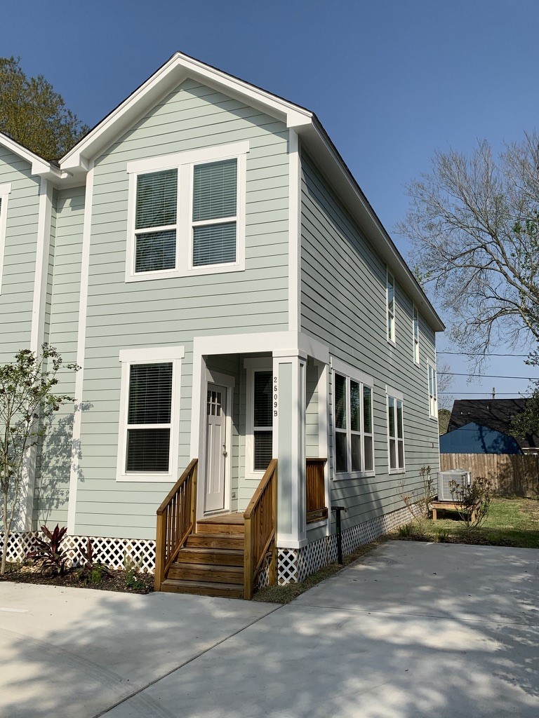 2509 South Grand Boulevard, Unit B Pearland, TX 77581 - Photo 2 of 13 a view of a house with a patio