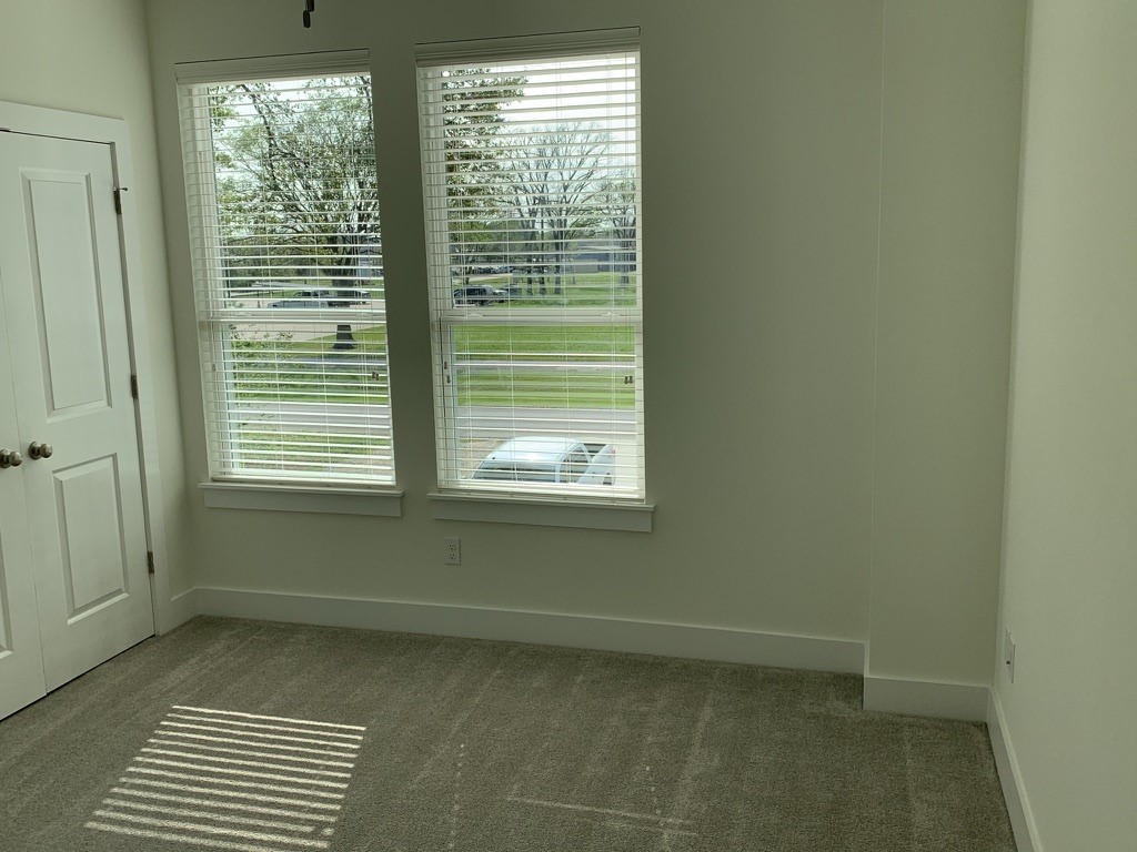 2509 South Grand Boulevard, Unit B Pearland, TX 77581 - Photo 7 of 13 a view of an empty room with a window