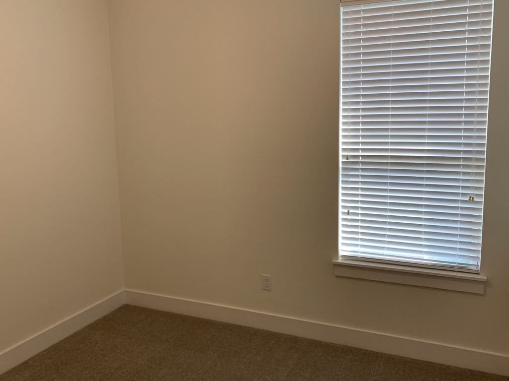 2509 South Grand Boulevard, Unit B Pearland, TX 77581 - Photo 10 of 13 a small space with a window