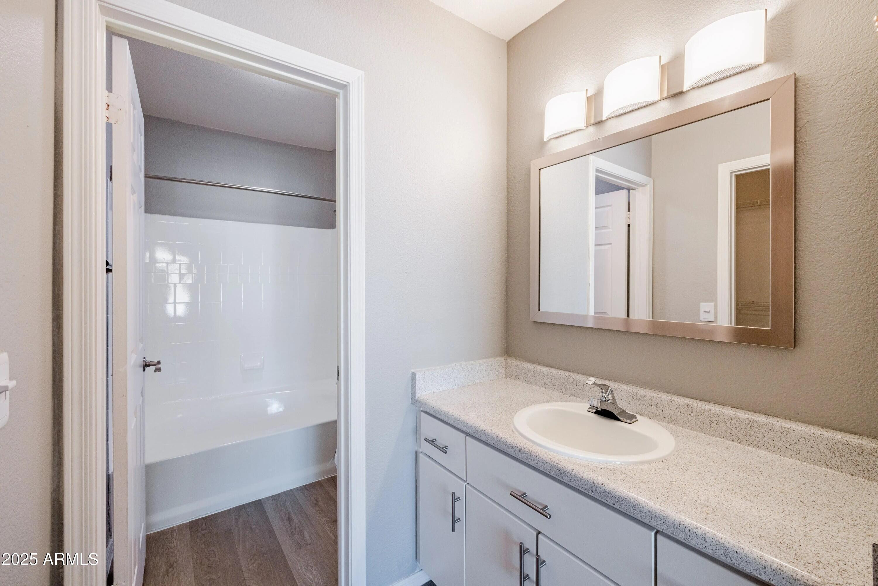 5151 East Guadalupe Road, Unit C1 Phoenix, AZ 85044 - Photo 6 of 23 a bathroom with a sink and a mirror