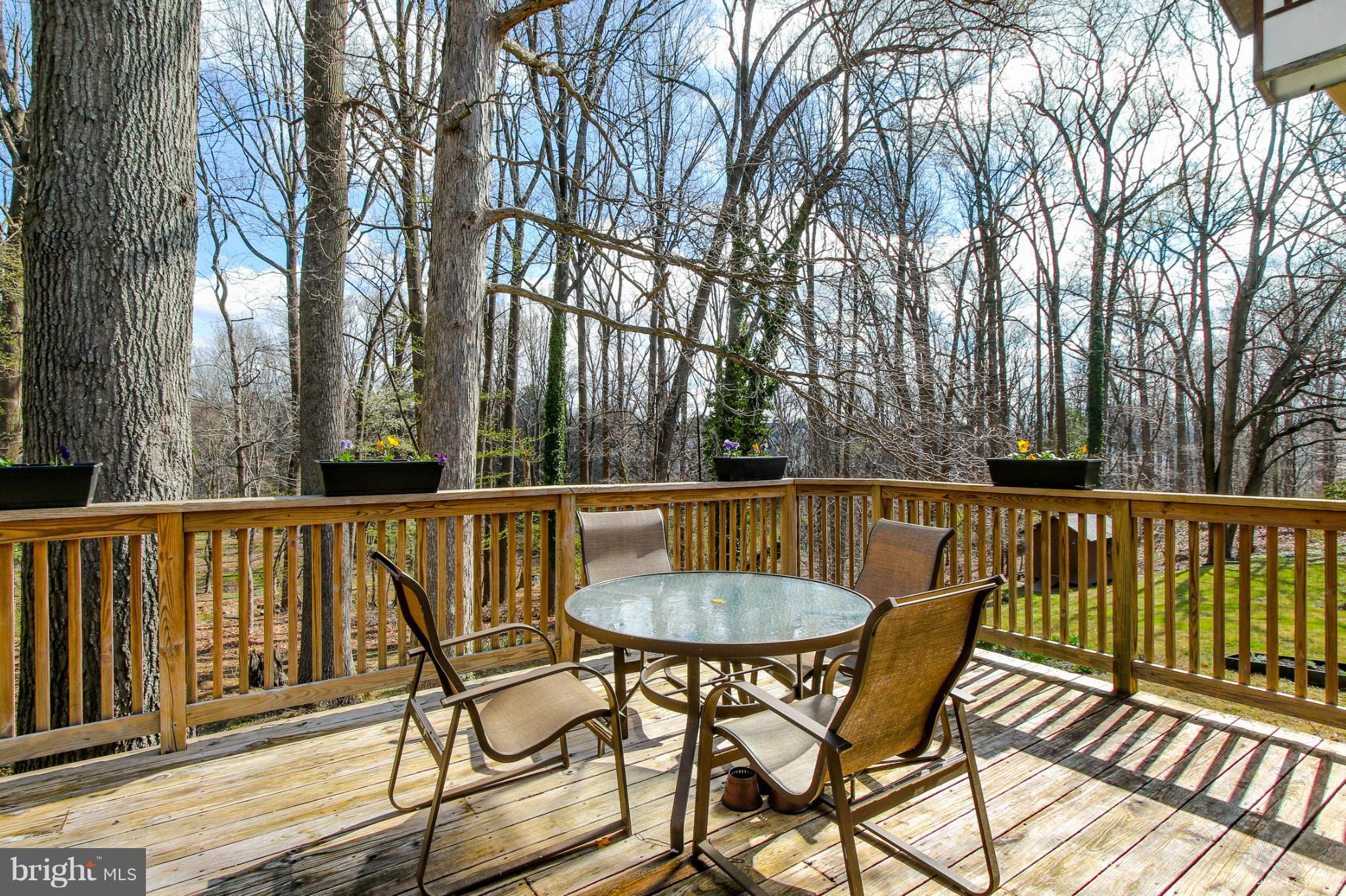 13201 Clifton Road Silver Spring, MD 20904 - Photo 28 of 30 a view of a chair and table on the deck