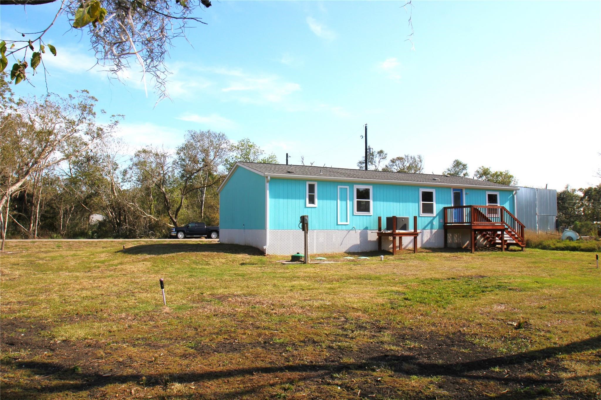 20406 Cr 510u Road Brazoria, TX 77422 - Photo 13 of 13 a view of a large pool with lawn chairs under an umbrella
