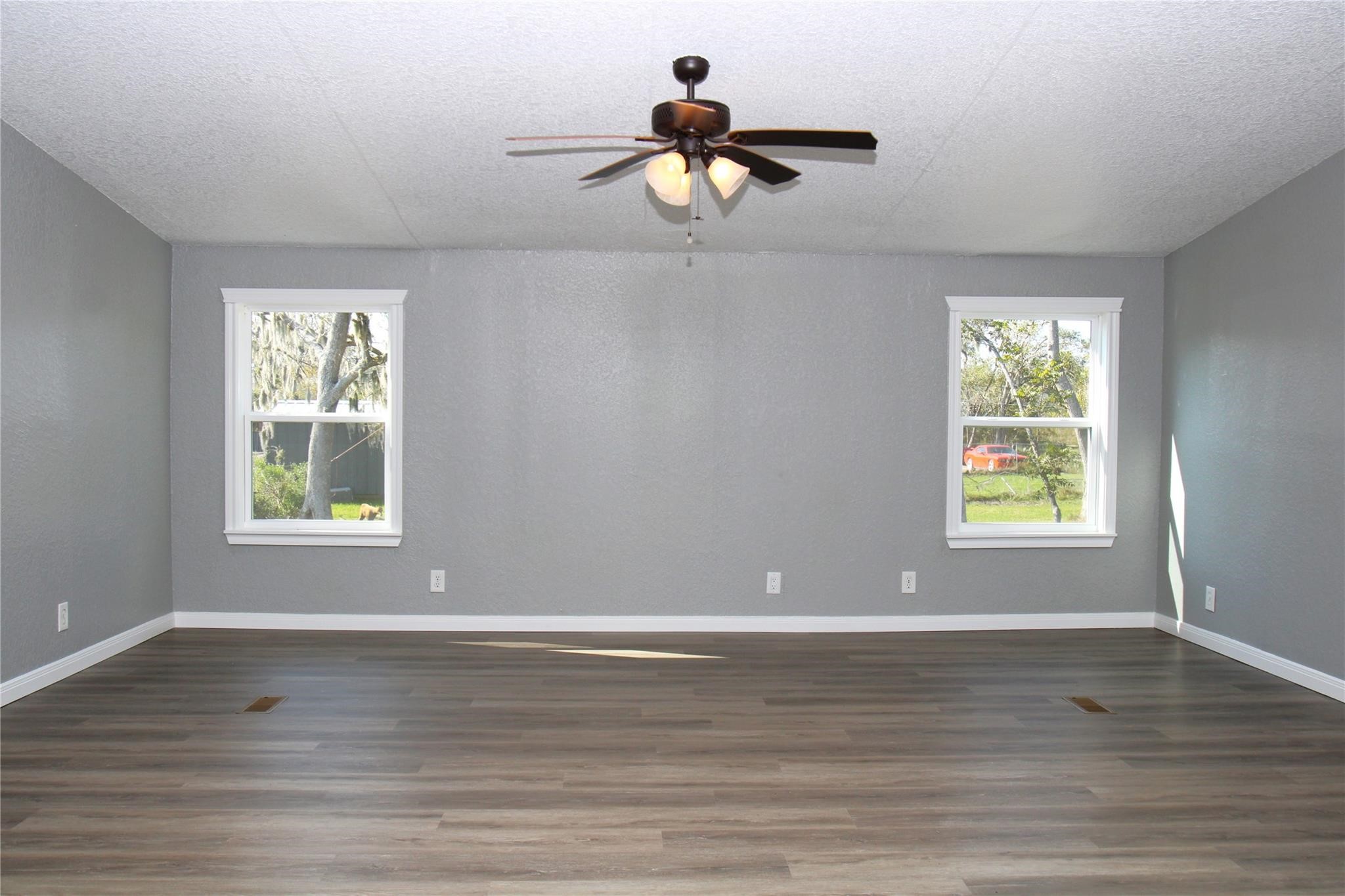 20406 Cr 510u Road Brazoria, TX 77422 - Photo 4 of 13 a view of room with window ceiling fan and hardwood floor
