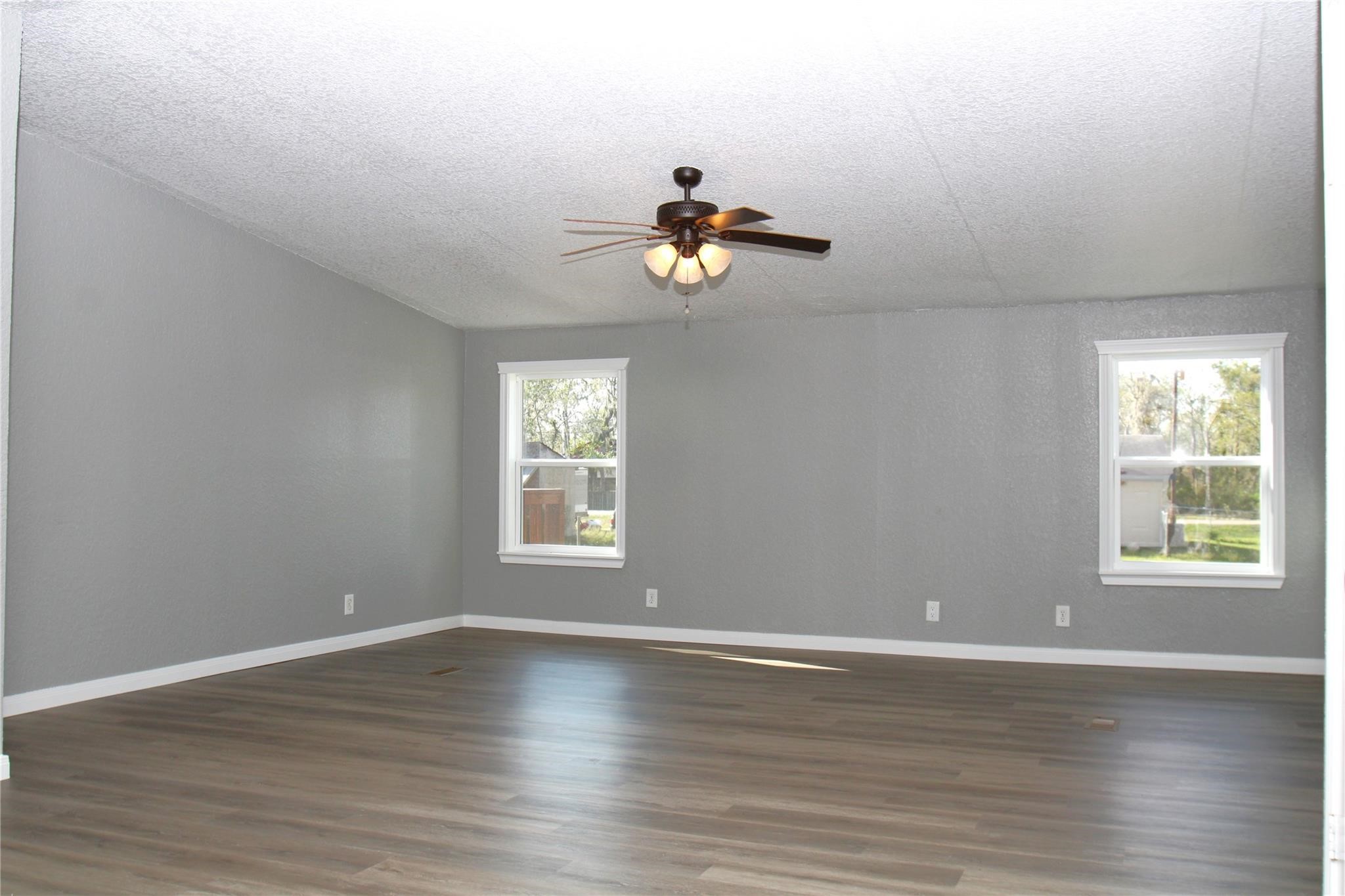 20406 Cr 510u Road Brazoria, TX 77422 - Photo 7 of 13 a view of a room with wooden floor and windows