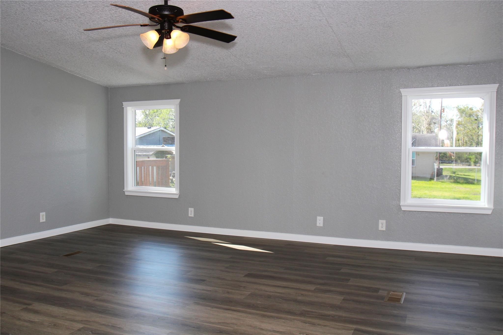 20406 Cr 510u Road Brazoria, TX 77422 - Photo 8 of 13 a view of an empty room with wooden floor and window