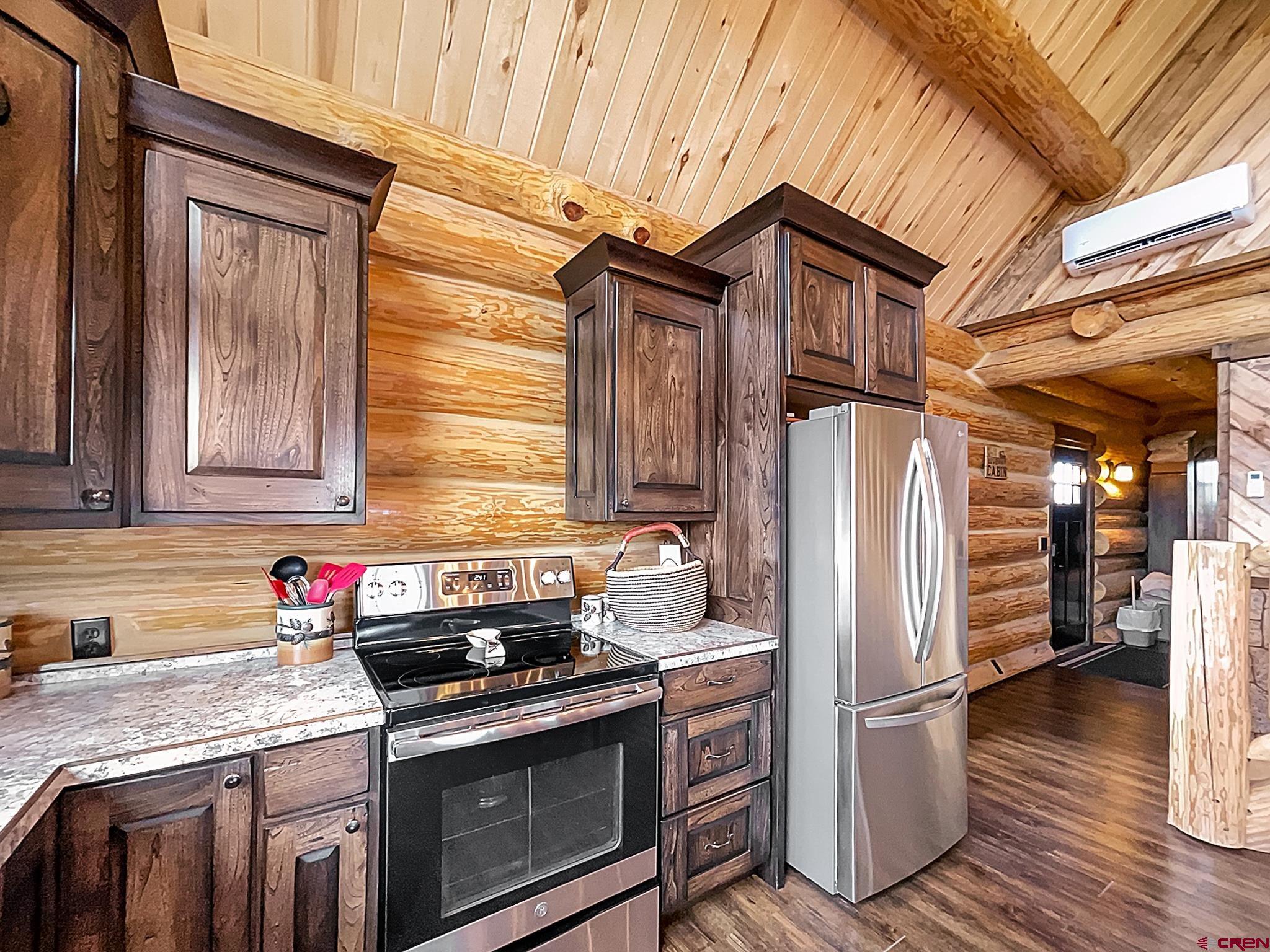 78114 Basalt Road Crawford, CO 81415 - Photo 15 of 35 a kitchen with stainless steel appliances granite countertop a refrigerator stove and sink