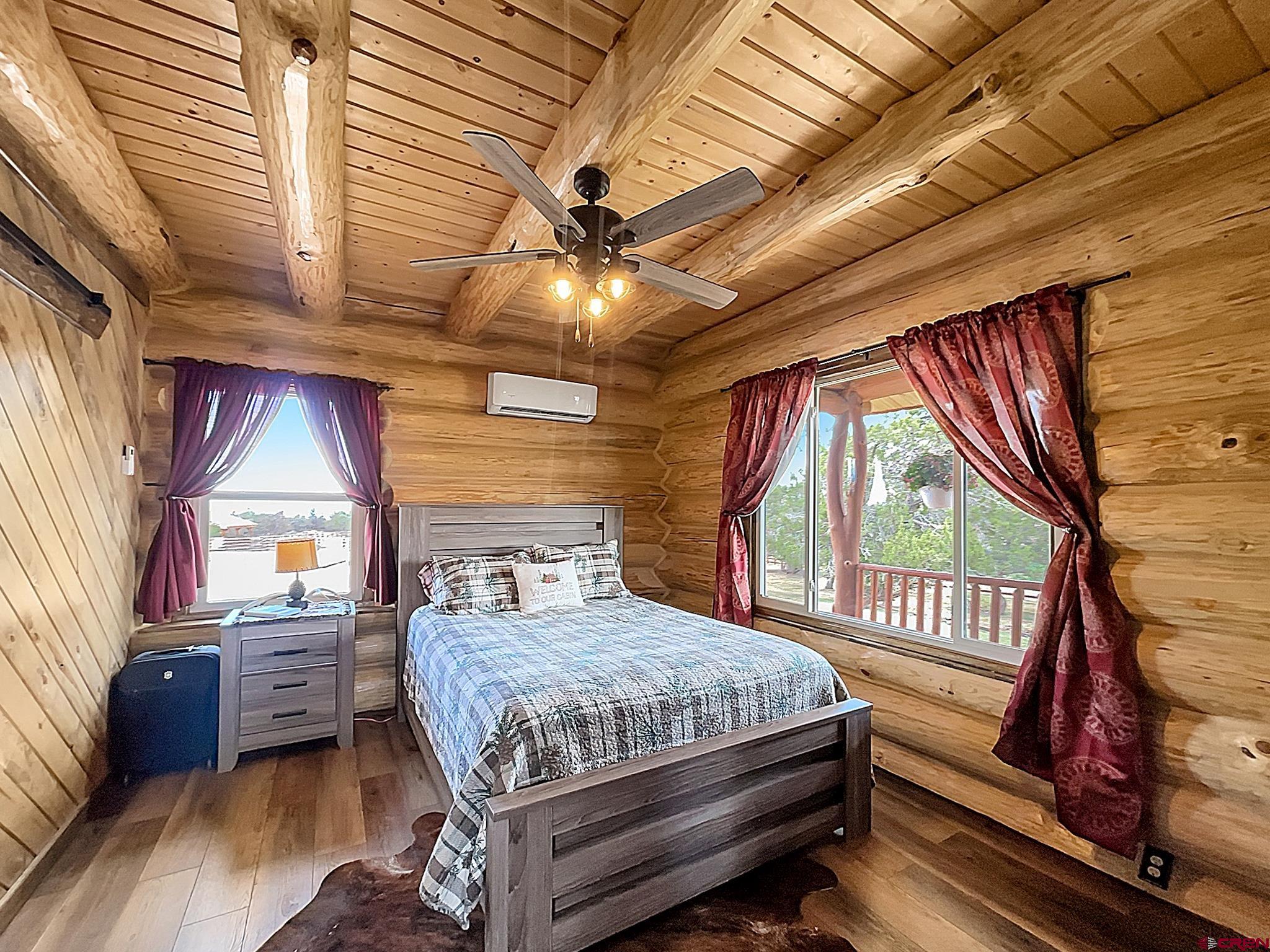78114 Basalt Road Crawford, CO 81415 - Photo 18 of 35 a bedroom with a bed next to a window