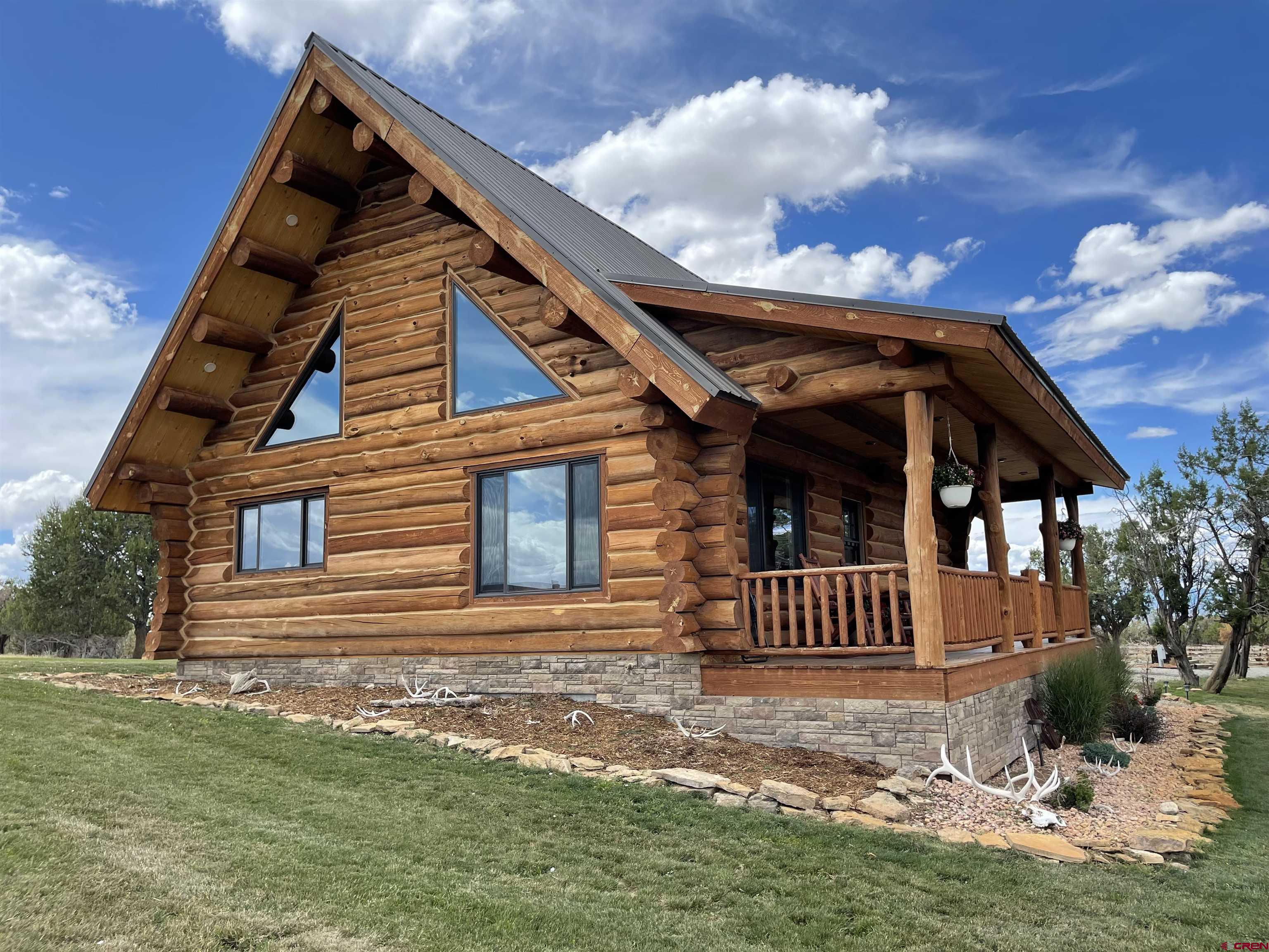 78114 Basalt Road Crawford, CO 81415 - Photo 2 of 35 front view of a house with a yard