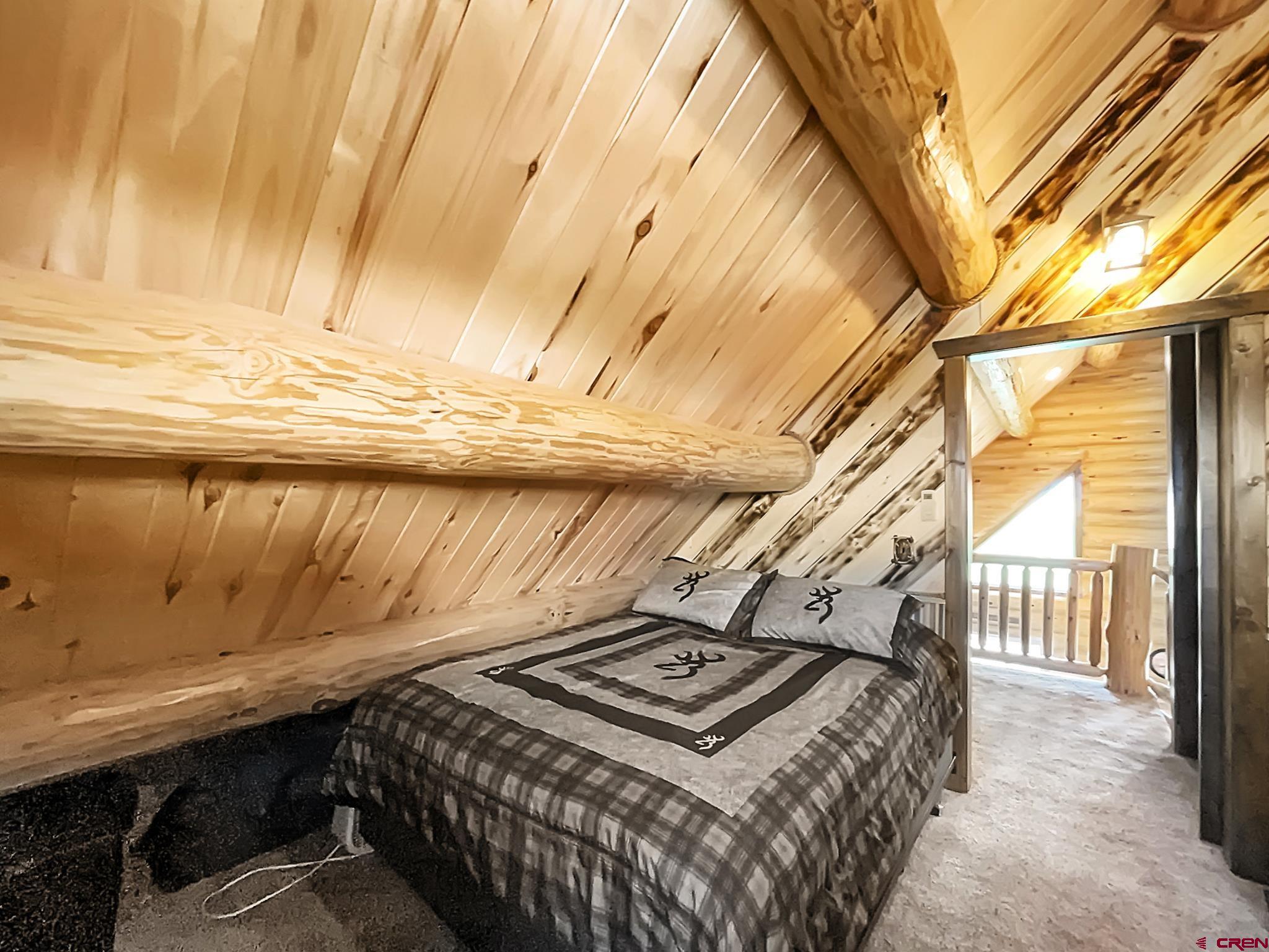 78114 Basalt Road Crawford, CO 81415 - Photo 25 of 35 a bedroom with a bed and a window