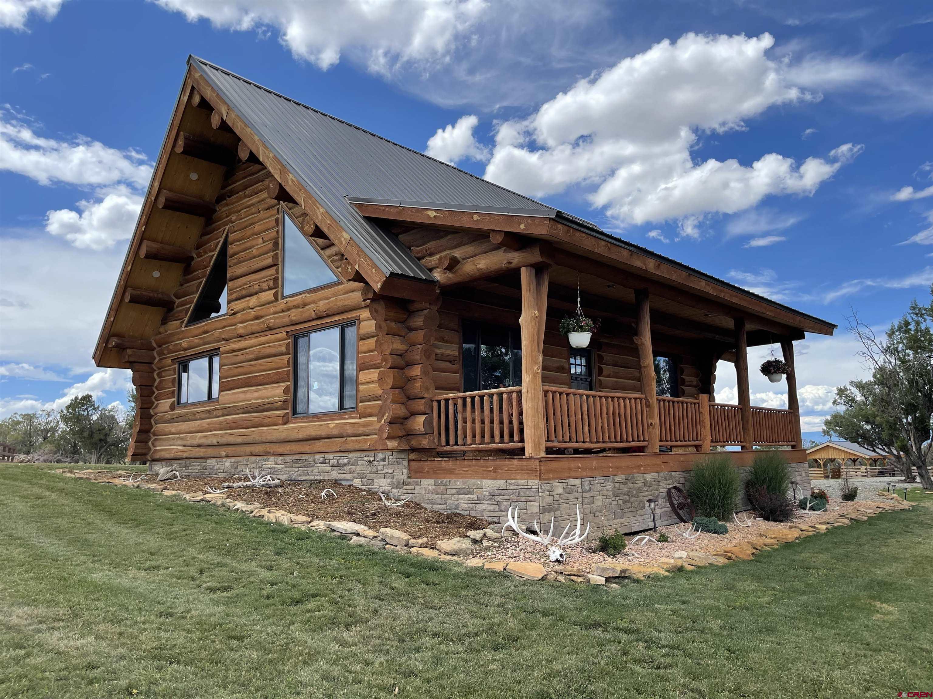 78114 Basalt Road Crawford, CO 81415 - Photo 31 of 35 a view of house and yard with green space