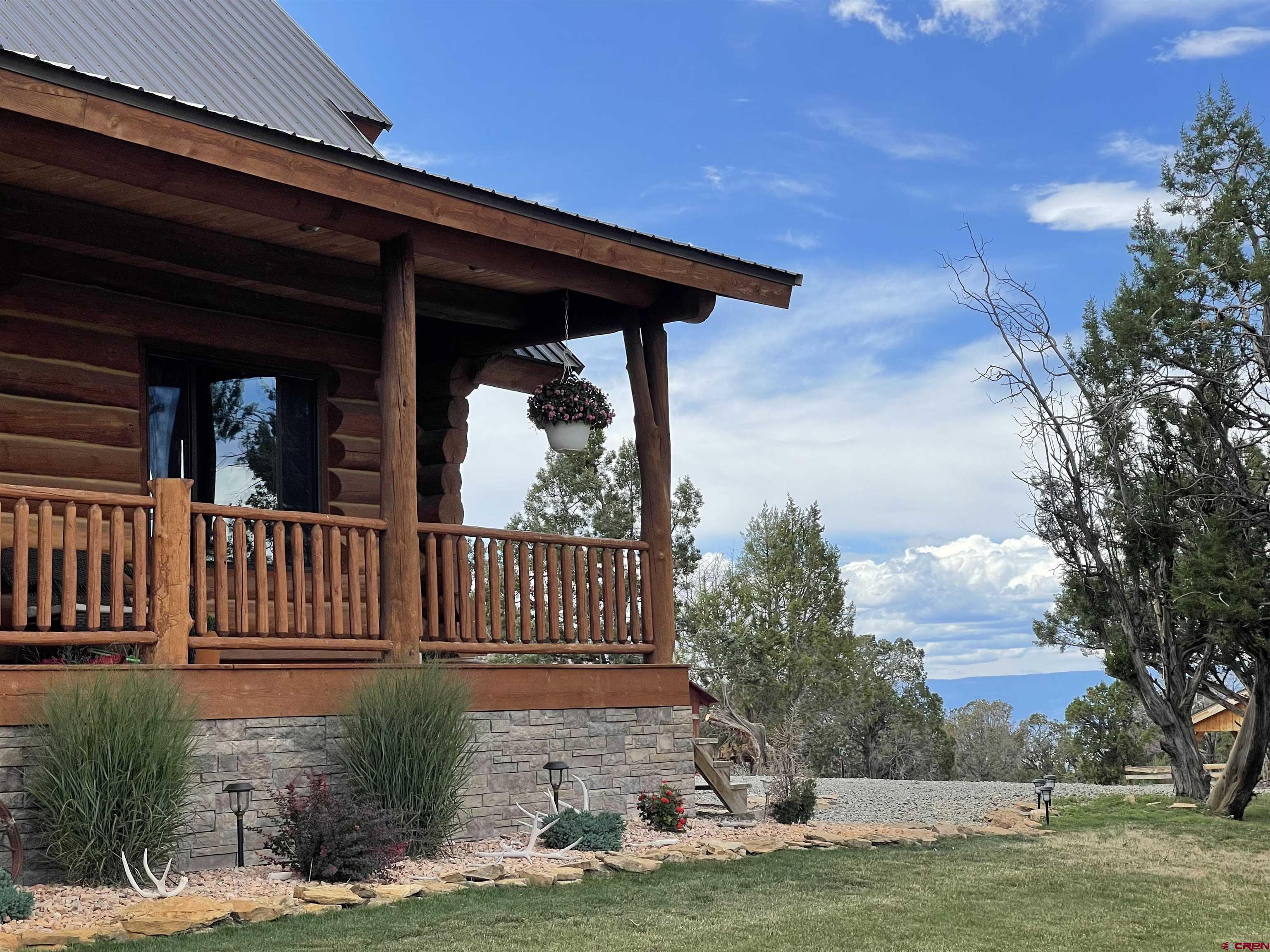 78114 Basalt Road Crawford, CO 81415 - Photo 4 of 35 a view of a chair and table in the patio
