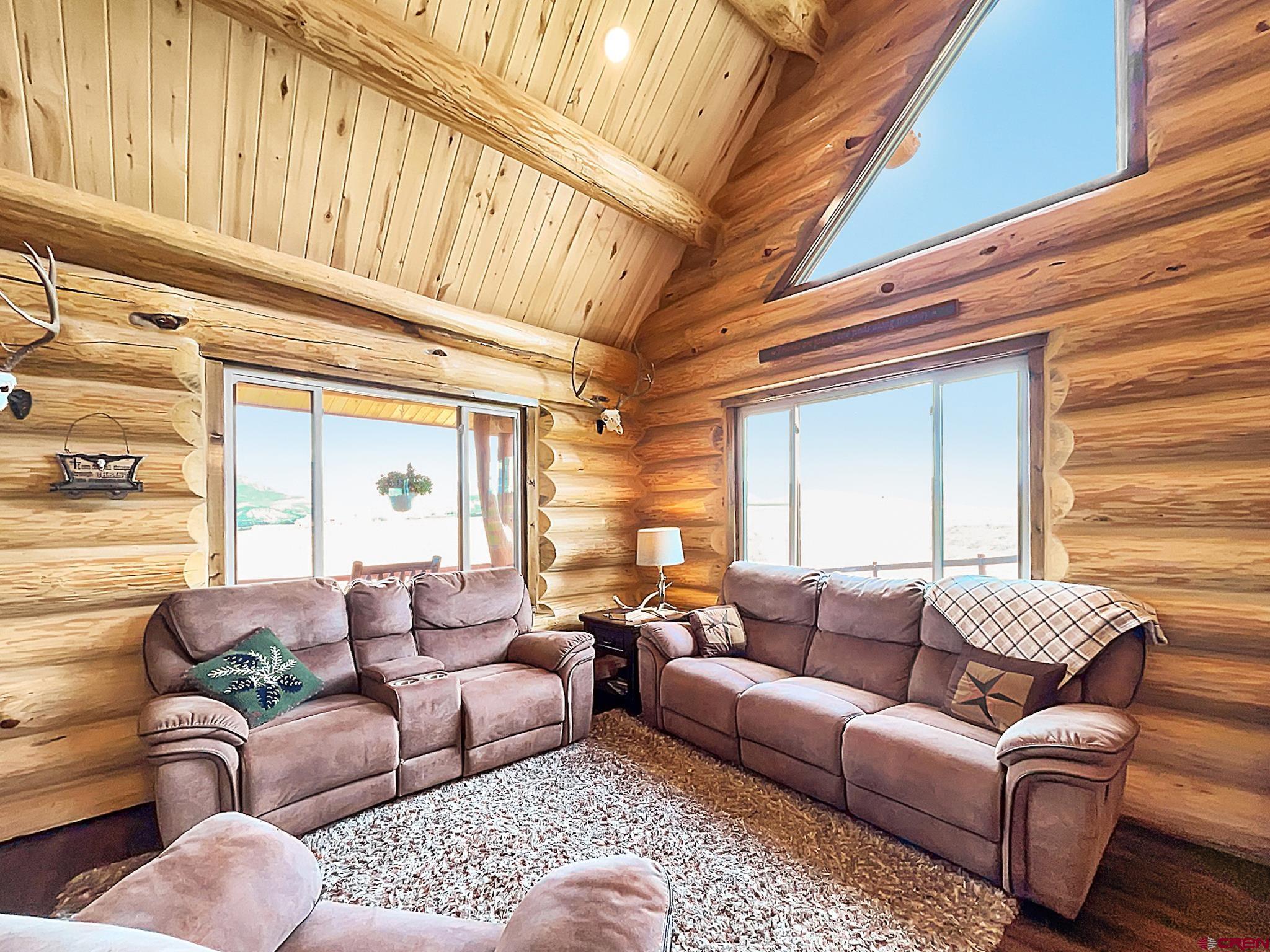 78114 Basalt Road Crawford, CO 81415 - Photo 9 of 35 a living room with furniture and a large window