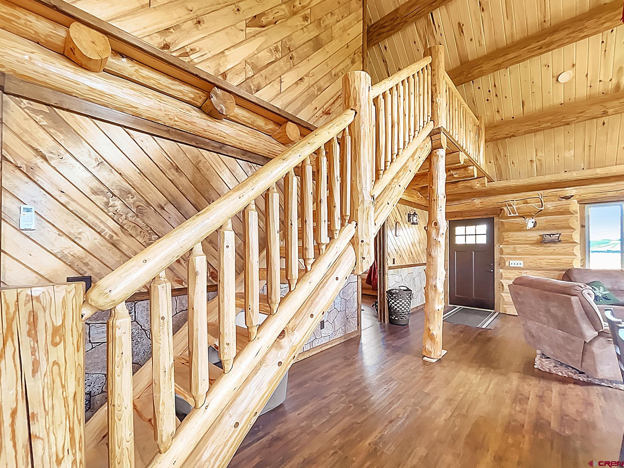 78114 Basalt Road Crawford, CO 81415 - Photo 10 of 35 a view of entryway with wooden floor and stairs