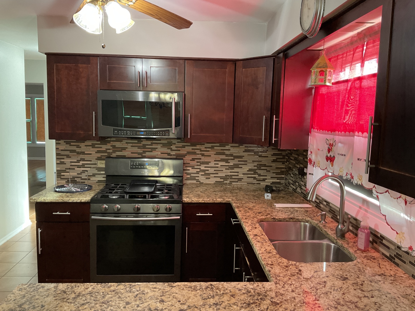 604 Exchange Avenue Calumet City, IL 60409 - Photo 11 of 39 a kitchen with a stove microwave and sink