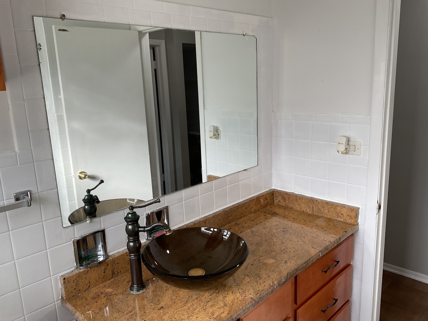 604 Exchange Avenue Calumet City, IL 60409 - Photo 7 of 39 a bathroom with a granite countertop sink and a mirror