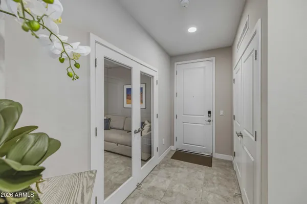 a kitchen with stainless steel appliances kitchen island granite countertop a stove refrigerator and cabinets