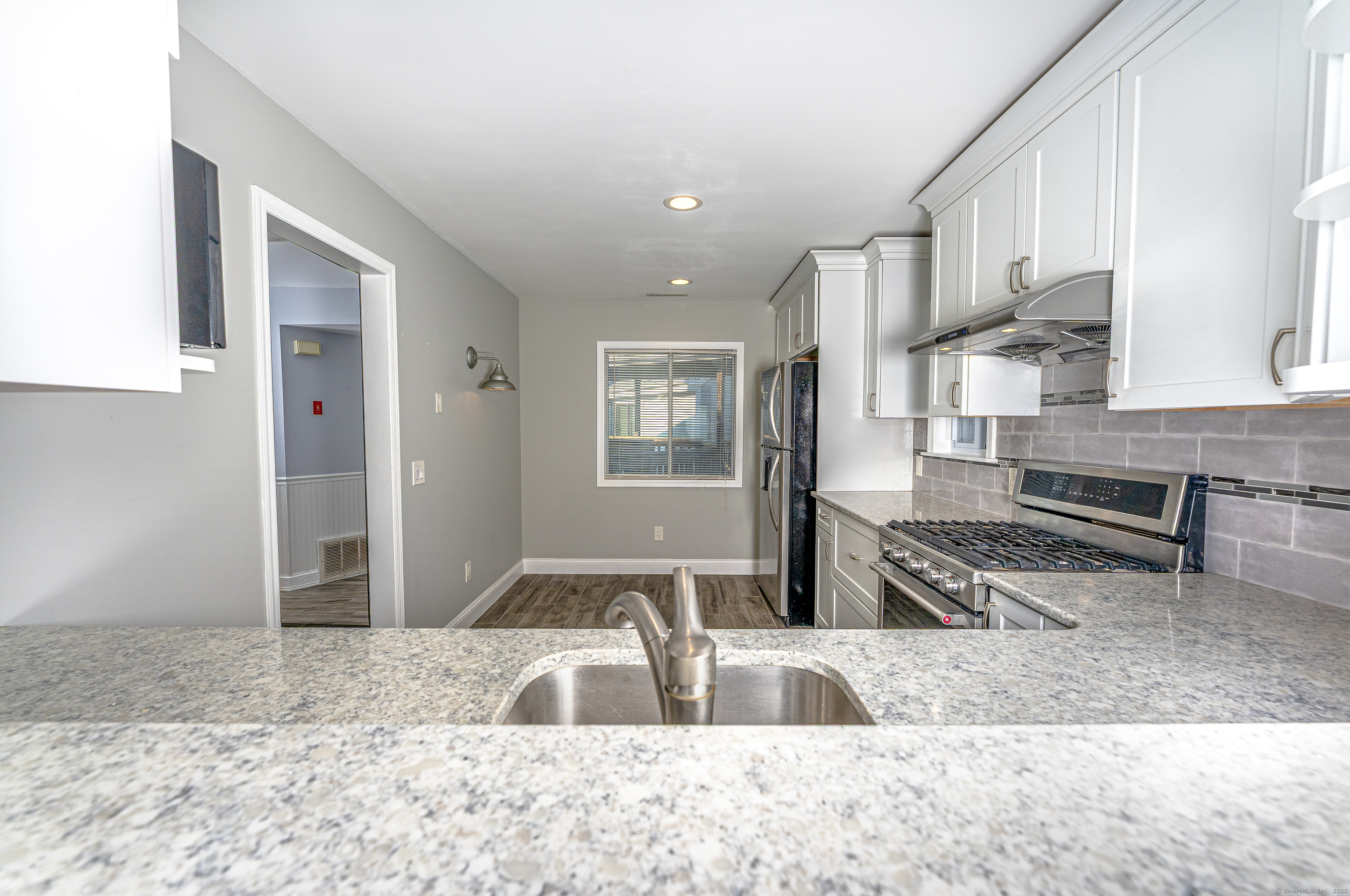 2 Mansfield Grove Road, Unit 374 East Haven, CT 06512 - Photo 12 of 30 a view of kitchen with sink and refrigerator