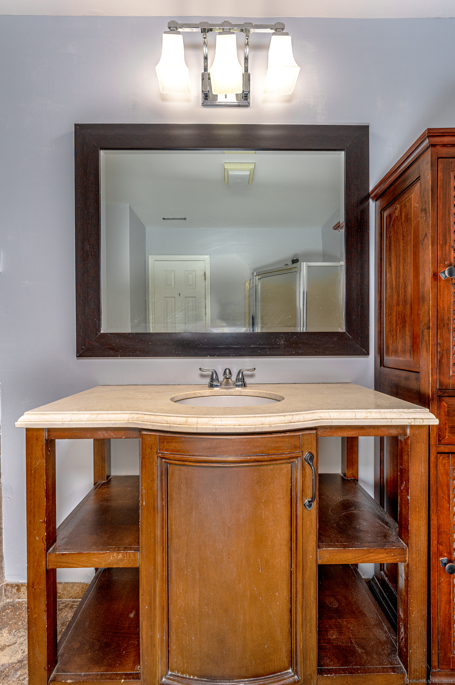2 Mansfield Grove Road, Unit 374 East Haven, CT 06512 - Photo 18 of 30 a bathroom with a sink and a mirror