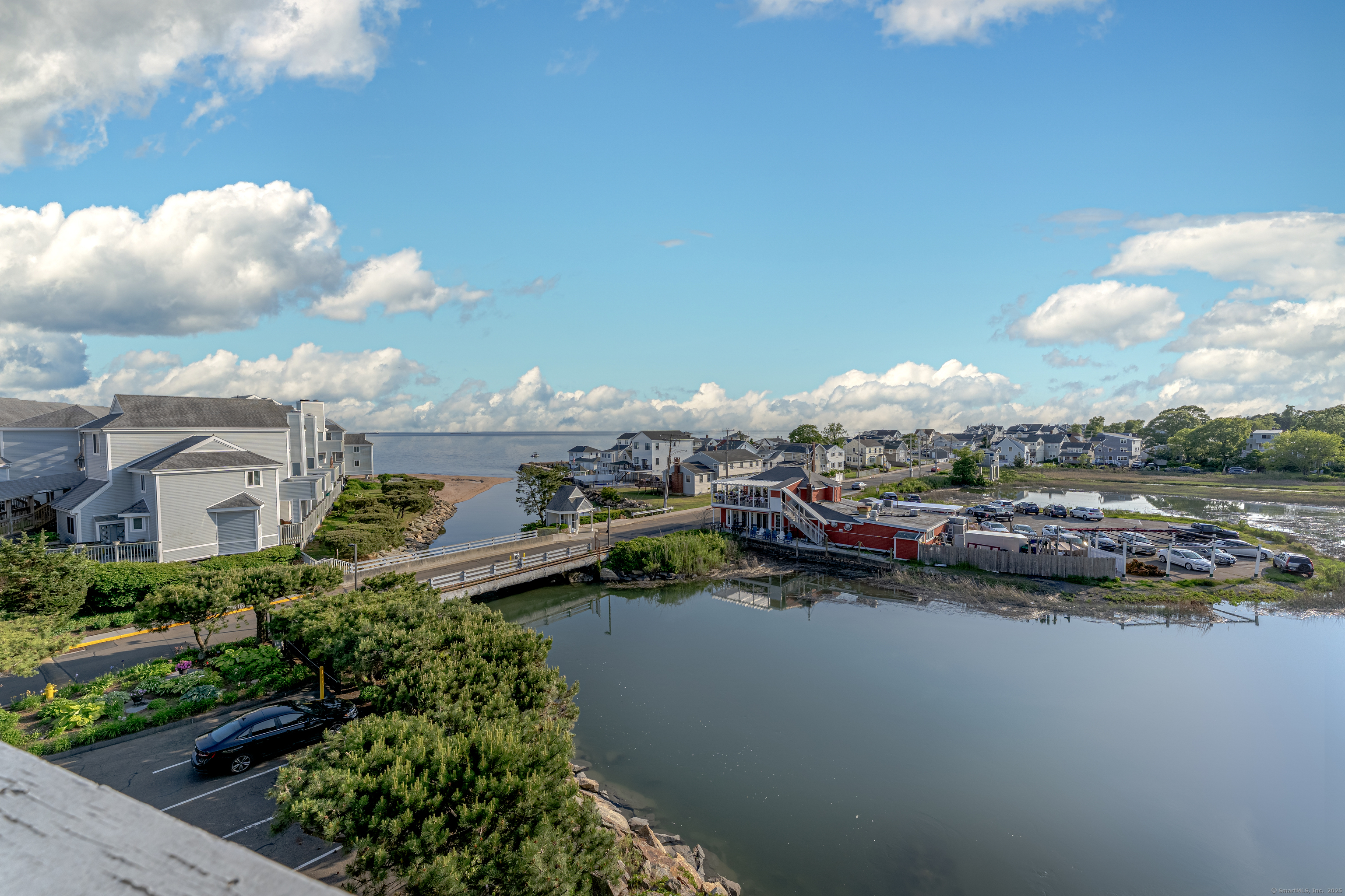 2 Mansfield Grove Road, Unit 374 East Haven, CT 06512 - Photo 25 of 30 a view of a lake with houses