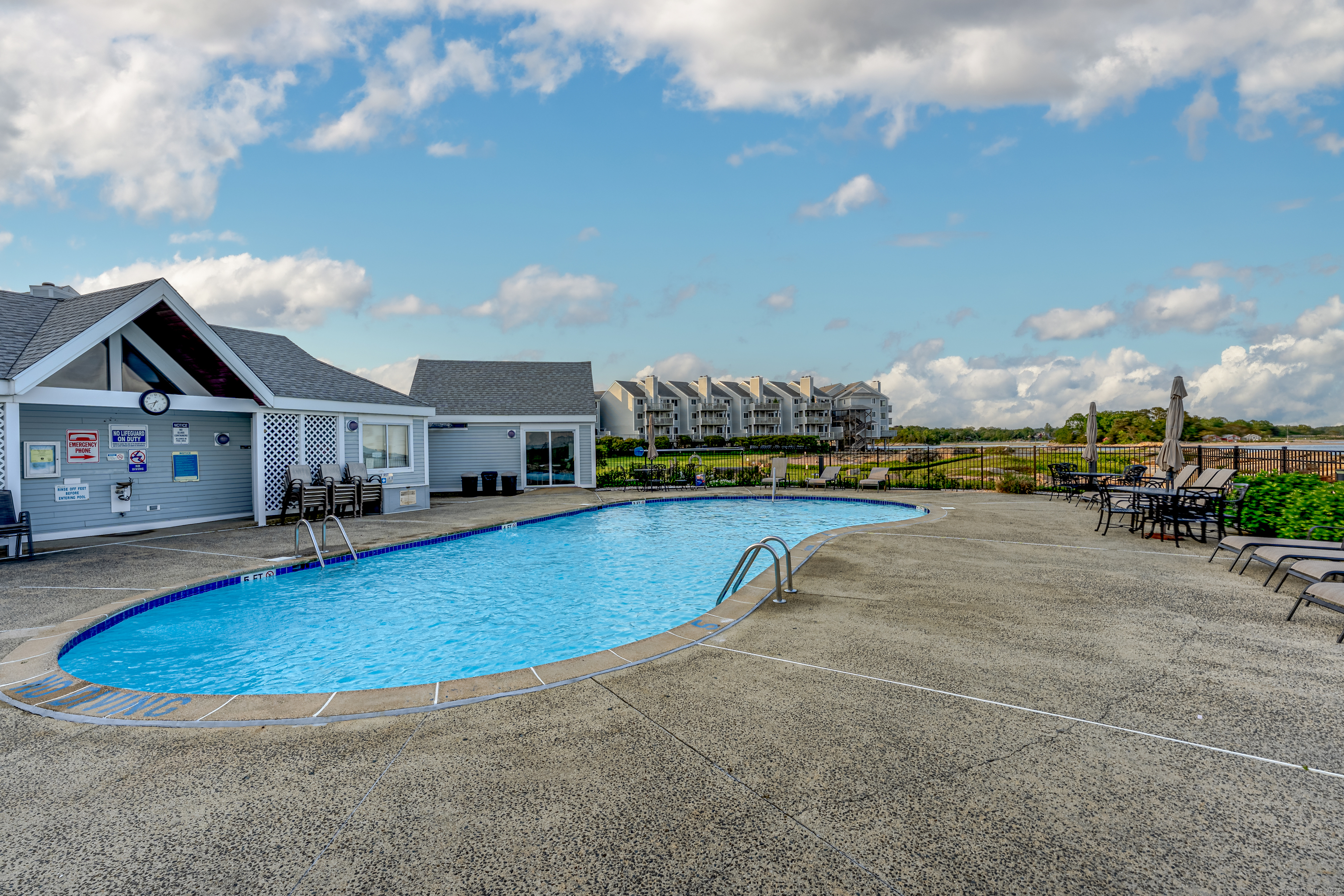 2 Mansfield Grove Road, Unit 374 East Haven, CT 06512 - Photo 27 of 30 a view of a swimming pool and a chairs