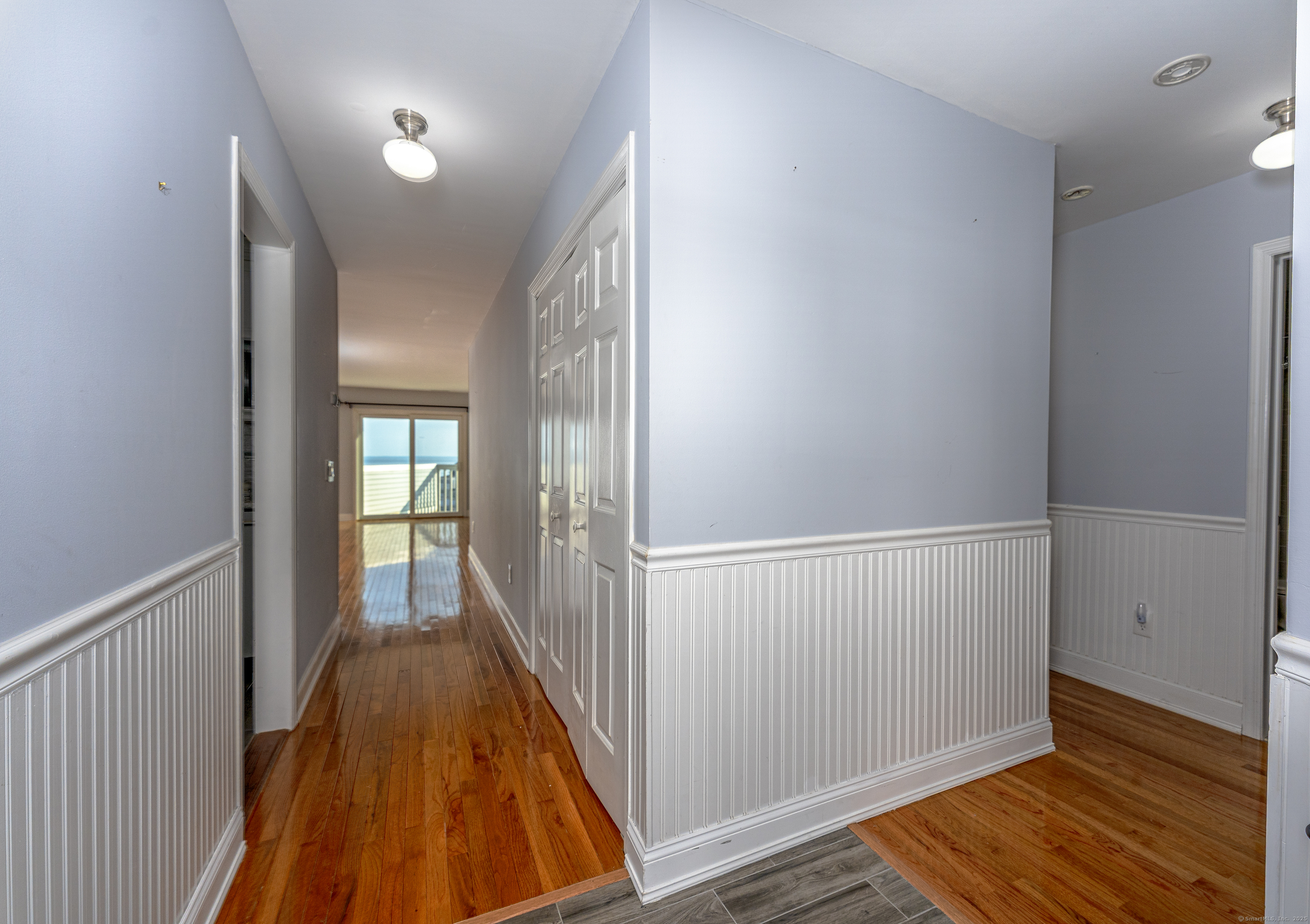 2 Mansfield Grove Road, Unit 374 East Haven, CT 06512 - Photo 3 of 30 a view of hallway with wooden floor