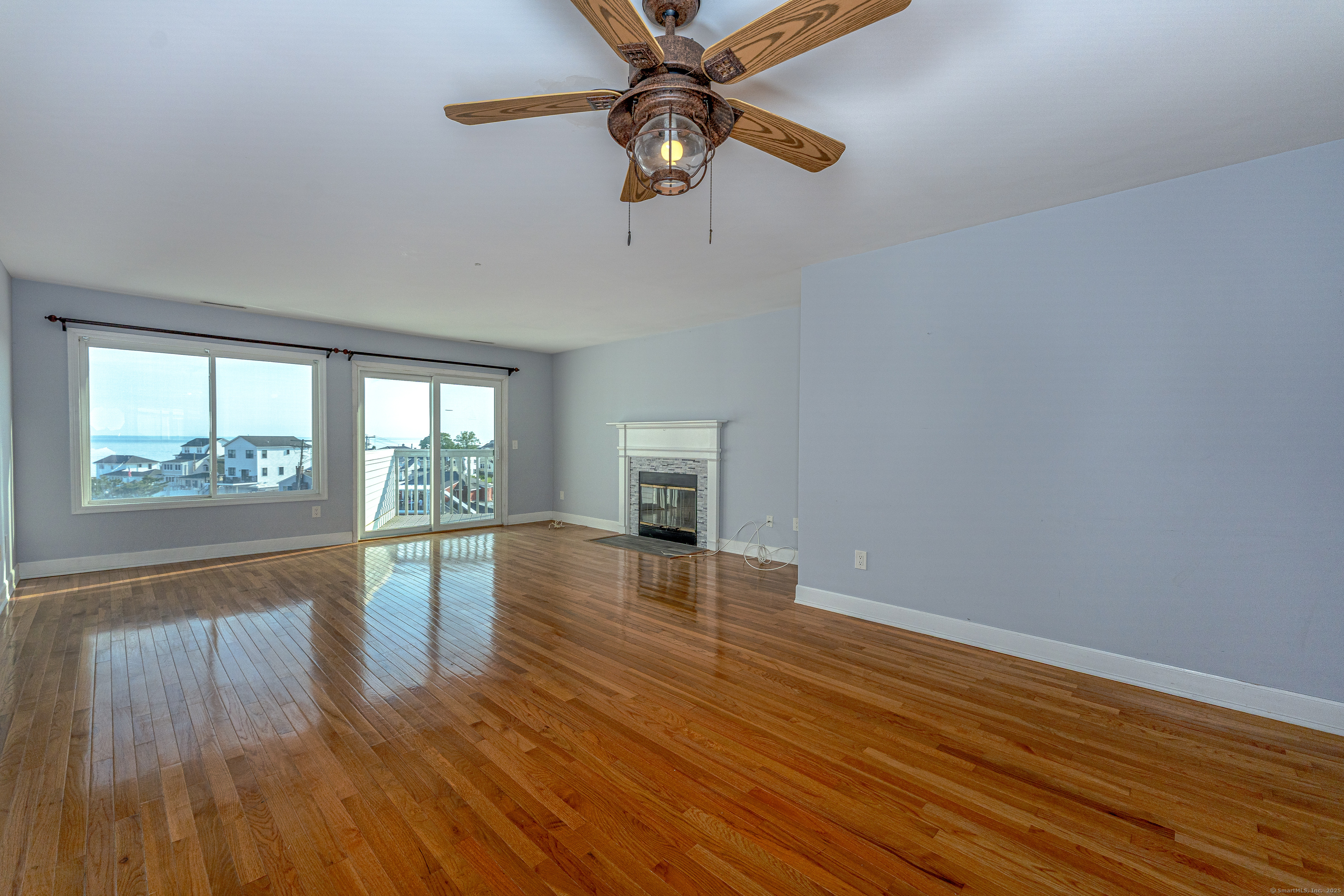 2 Mansfield Grove Road, Unit 374 East Haven, CT 06512 - Photo 8 of 30 a view of empty room with wooden floor and fan