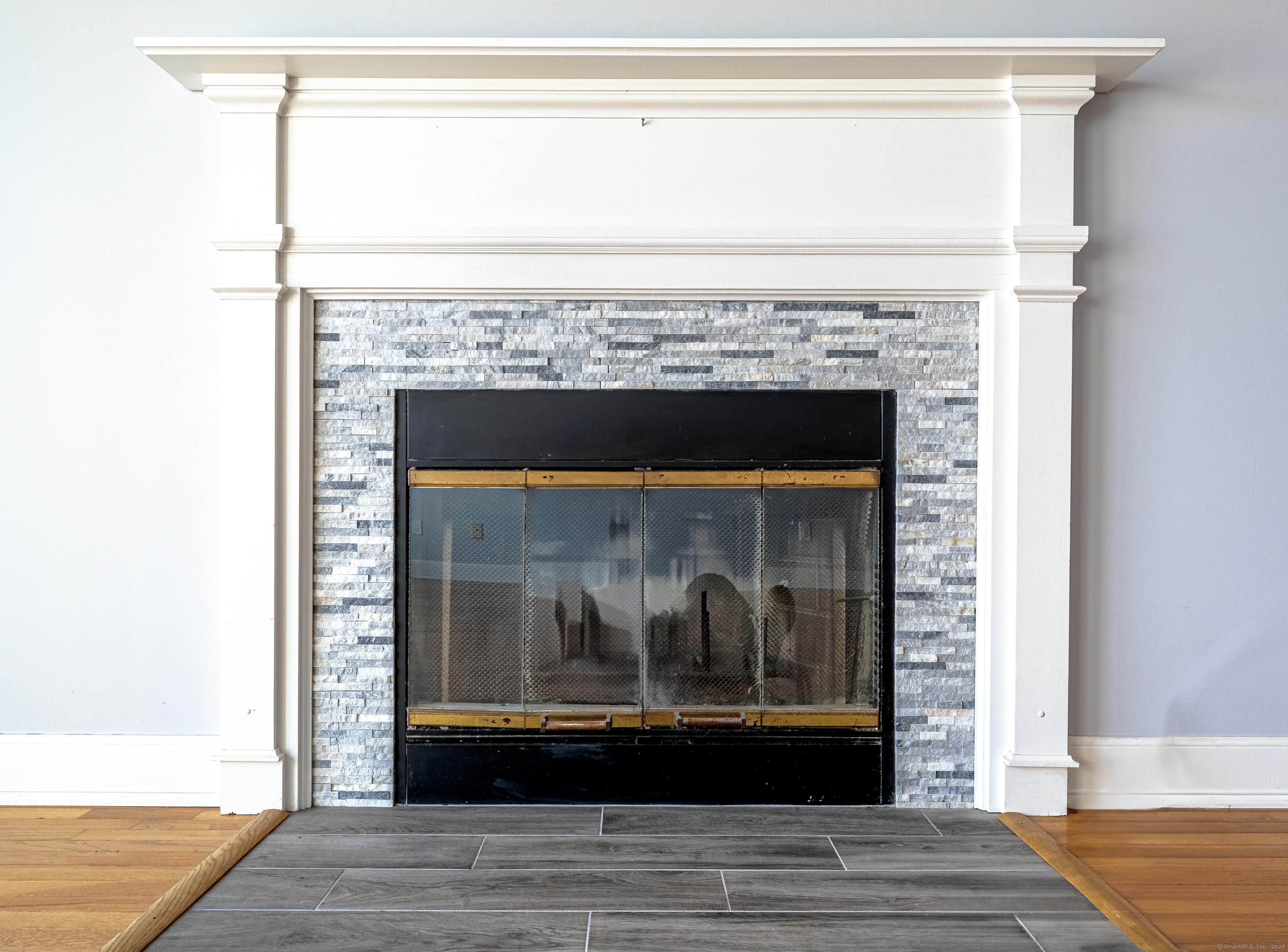 2 Mansfield Grove Road, Unit 374 East Haven, CT 06512 - Photo 9 of 30 a view of fireplace and utility room