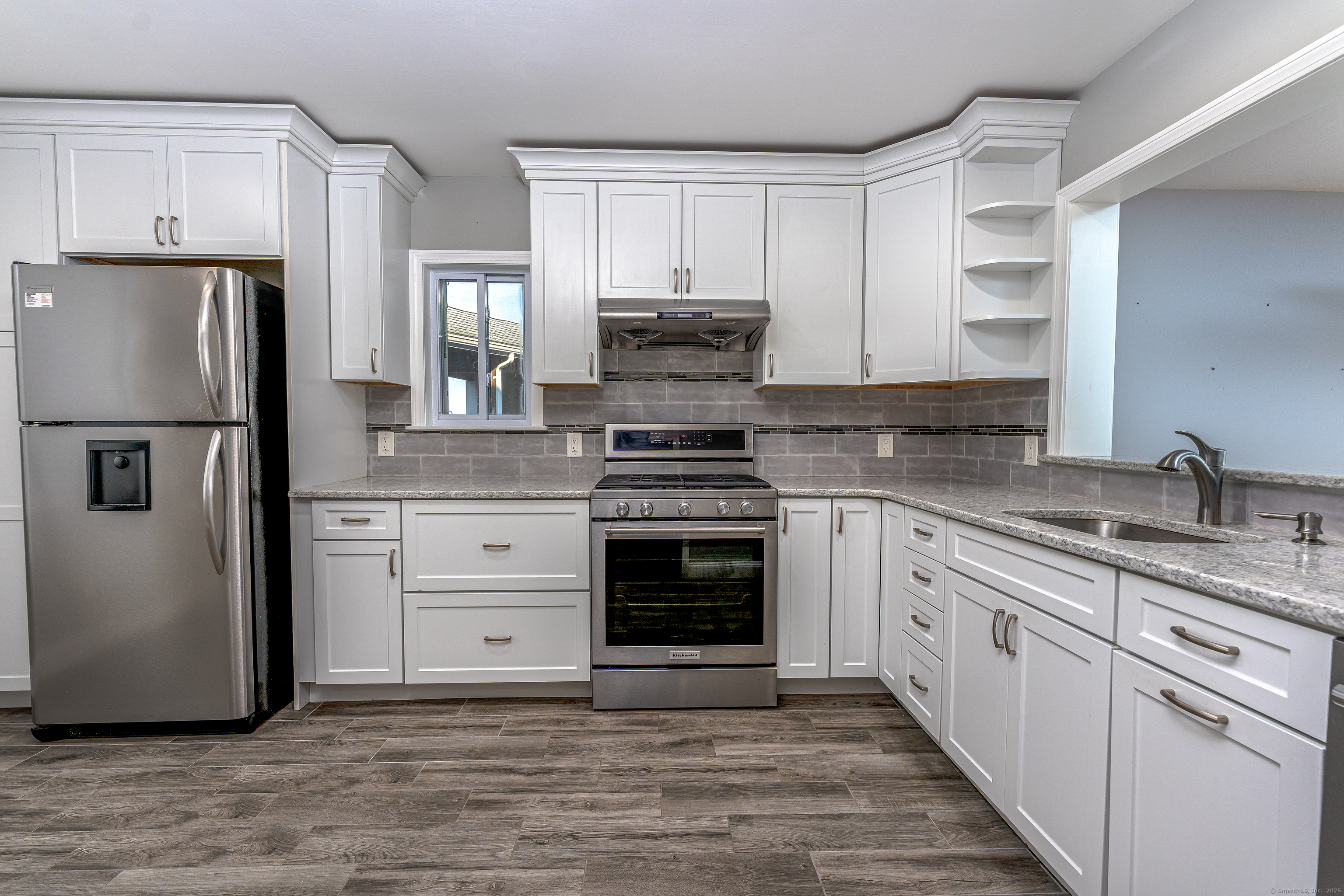 2 Mansfield Grove Road, Unit 374 East Haven, CT 06512 - Photo 10 of 30 a kitchen with cabinets stainless steel appliances and a counter space