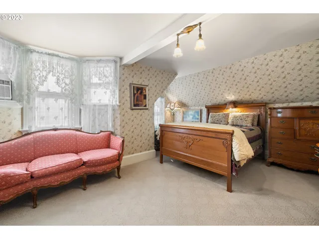 a bedroom with furniture and windows