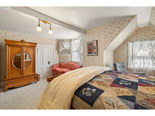 a bedroom with a bed and a cabinets