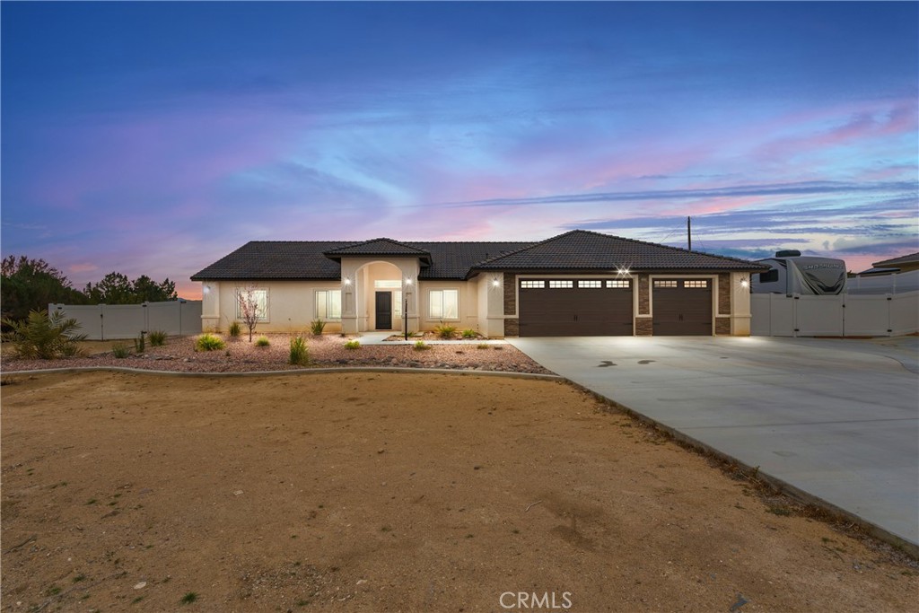 16320 Monache Road Apple Valley, CA 92307 - Photo 1 of 1 a front view of a house with a yard