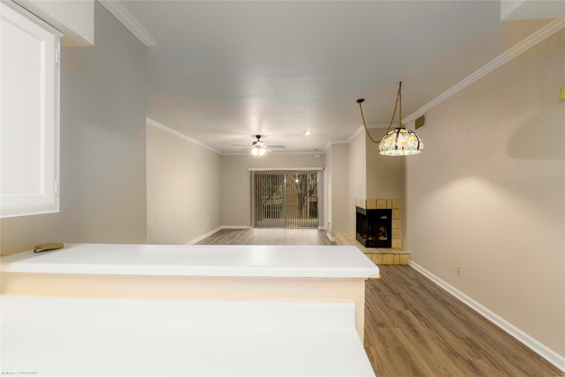 2450 Wickersham Lane, Unit 1001 Austin, TX 78741 - Photo 8 of 18 a large white bed in a room next to a window