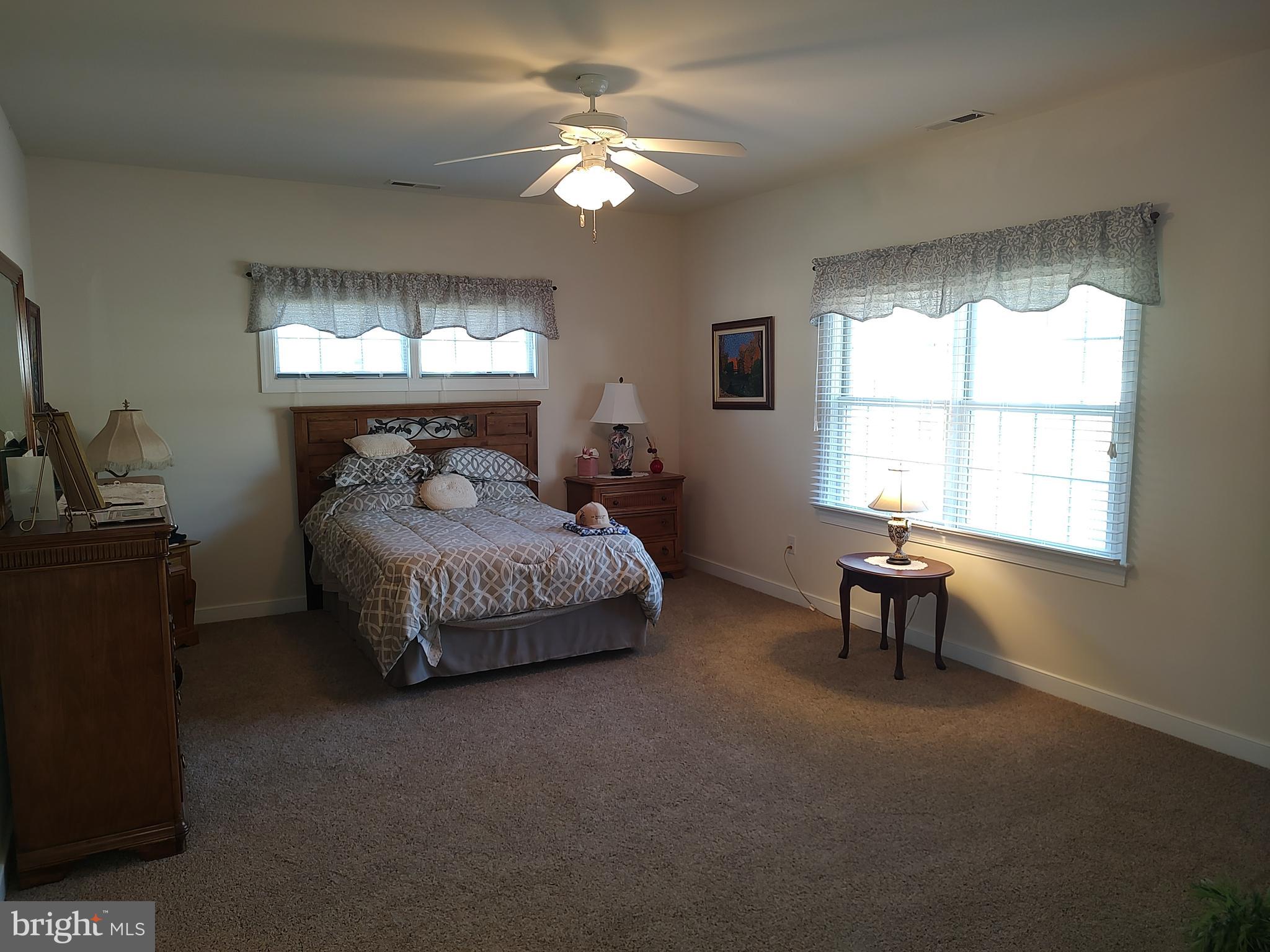 2 Castleberry Lane Georgetown, DE 19947 - Photo 23 of 46 a bedroom with bed and a large window