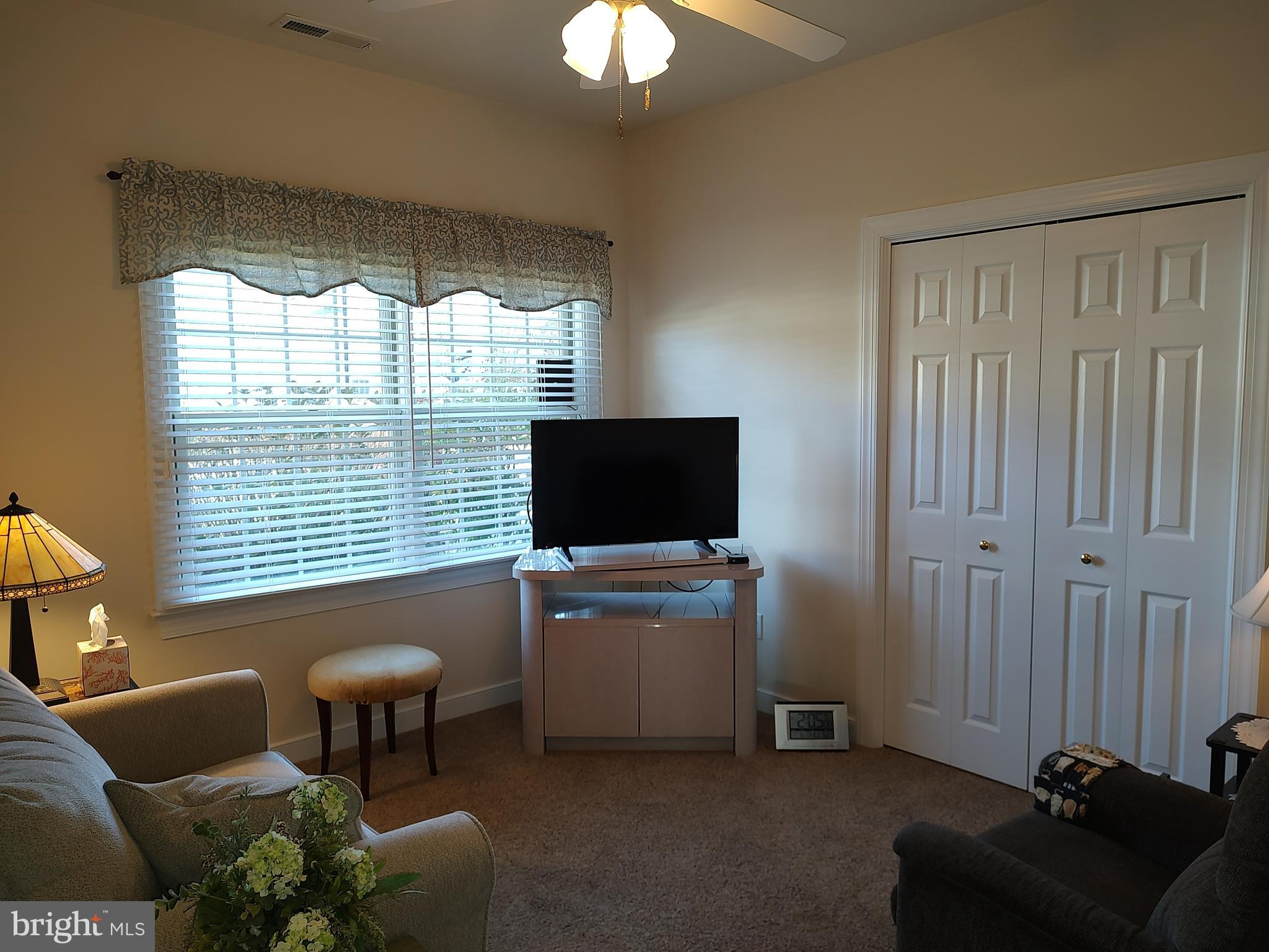2 Castleberry Lane Georgetown, DE 19947 - Photo 36 of 46 a living room with furniture and a flat screen tv