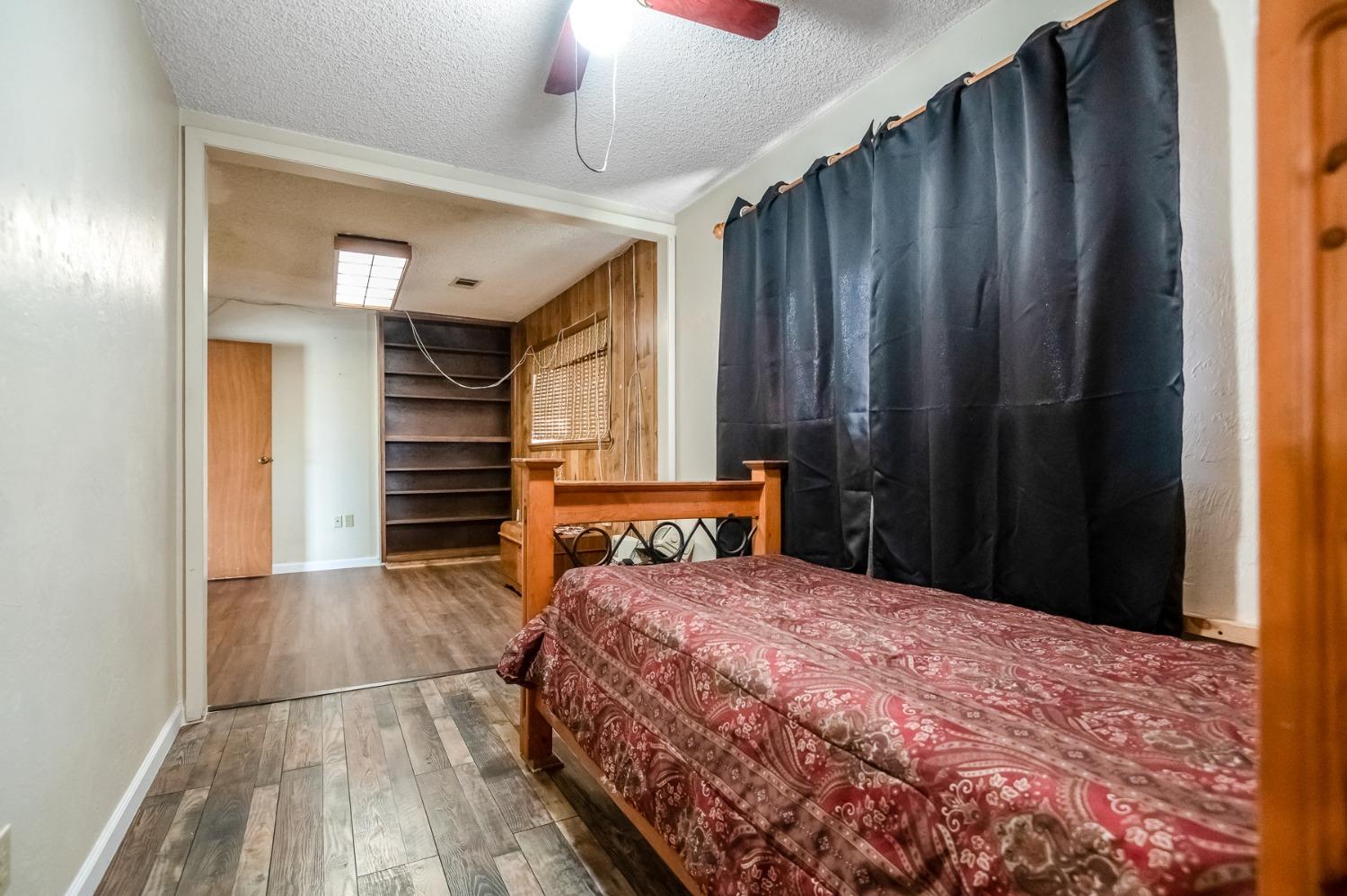 4306 Avenue 50 Alpaugh, CA 93201 - Photo 17 of 56 a bedroom with a bed and a dresser