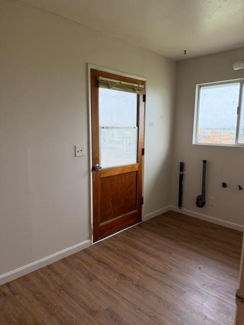 4306 Avenue 50 Alpaugh, CA 93201 - Photo 39 of 56 an empty room with wooden floor and windows