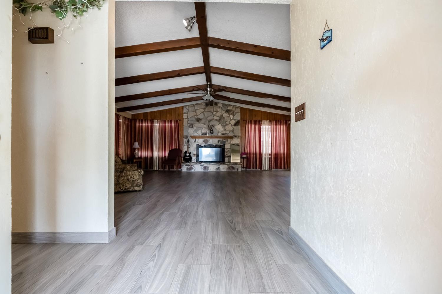 4306 Avenue 50 Alpaugh, CA 93201 - Photo 5 of 56 a view of a hallway to a house and wooden floor