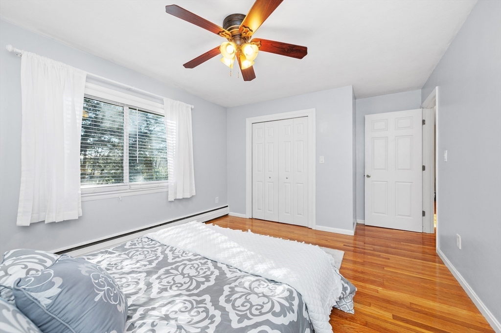 33 Jacqueline Road, Unit D Waltham, MA 02452 - Photo 13 of 26 a bedroom with a bed and a window