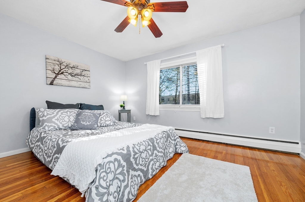 33 Jacqueline Road, Unit D Waltham, MA 02452 - Photo 14 of 26 a bedroom with a bed and window