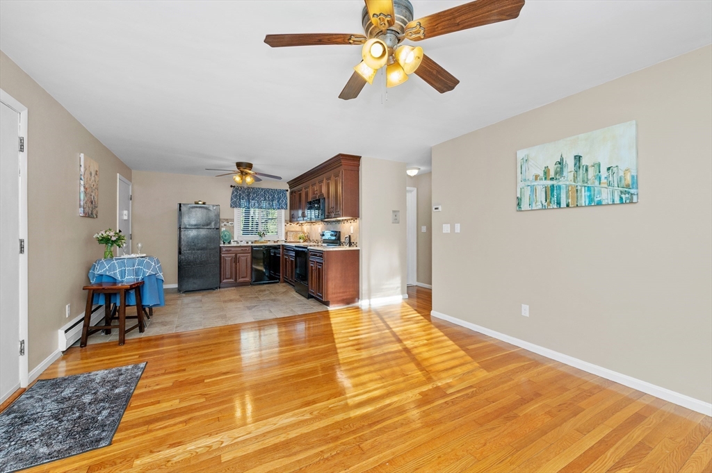 33 Jacqueline Road, Unit D Waltham, MA 02452 - Photo 2 of 26 a view of kitchen and dining room with wooden floor