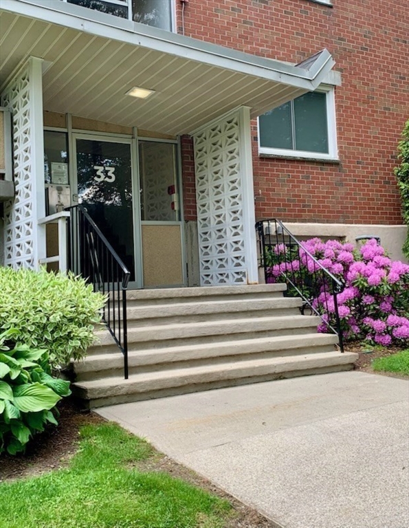 33 Jacqueline Road, Unit D Waltham, MA 02452 - Photo 24 of 26 a view of a house with potted plants
