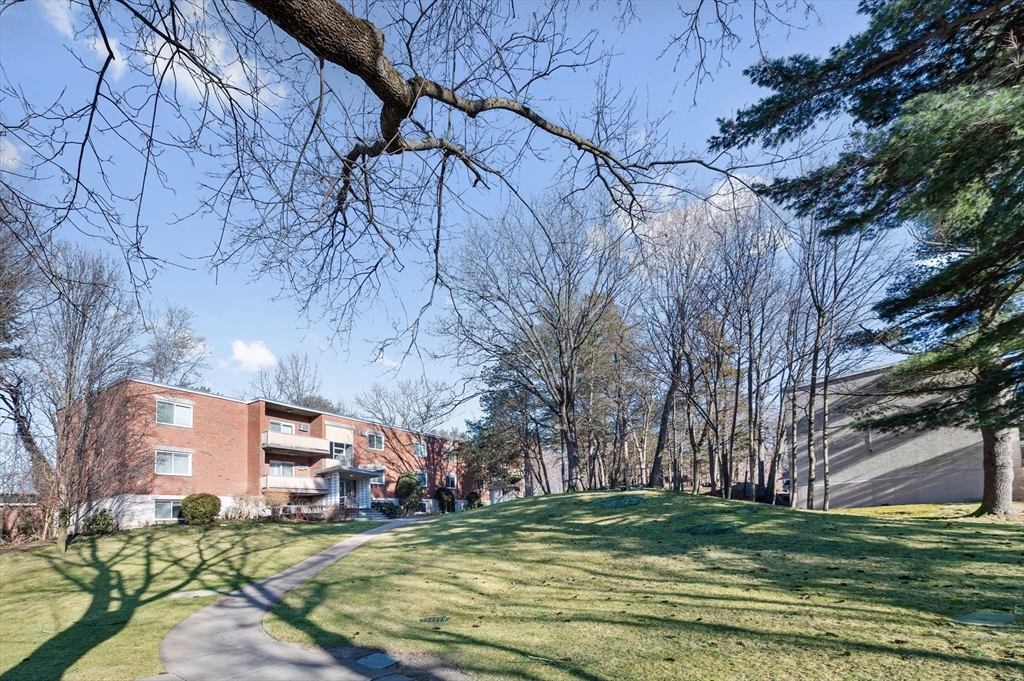 33 Jacqueline Road, Unit D Waltham, MA 02452 - Photo 25 of 26 a view of a house with a yard