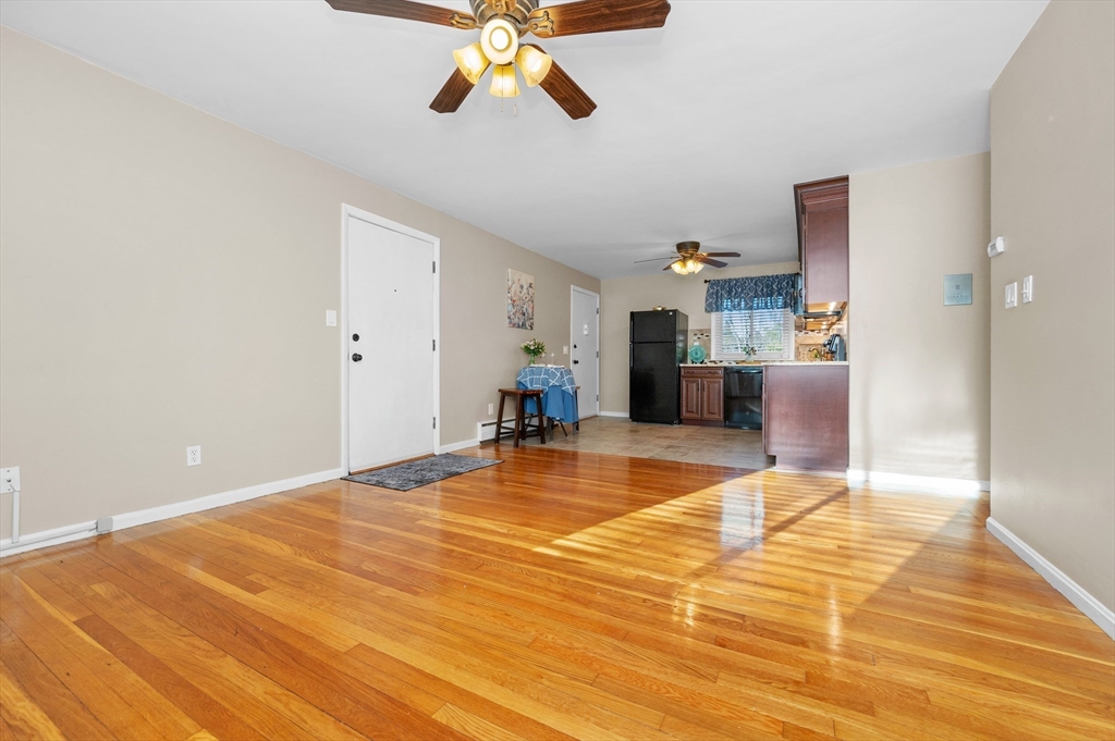 33 Jacqueline Road, Unit D Waltham, MA 02452 - Photo 10 of 26 a view of a room with wooden floor and furniture