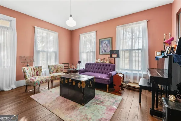 a living room with furniture and a window