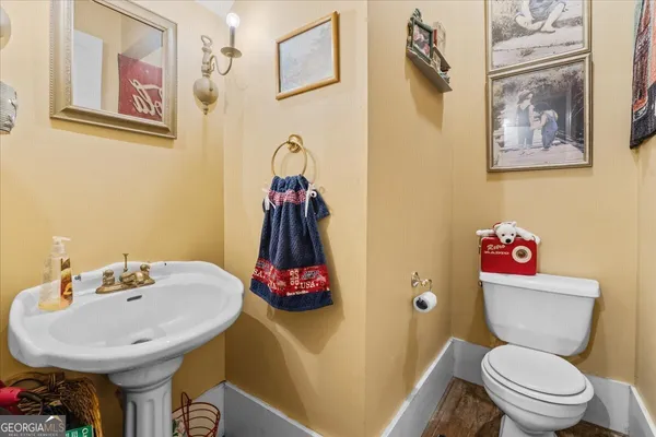 a bathroom with a sink toilet and a shower