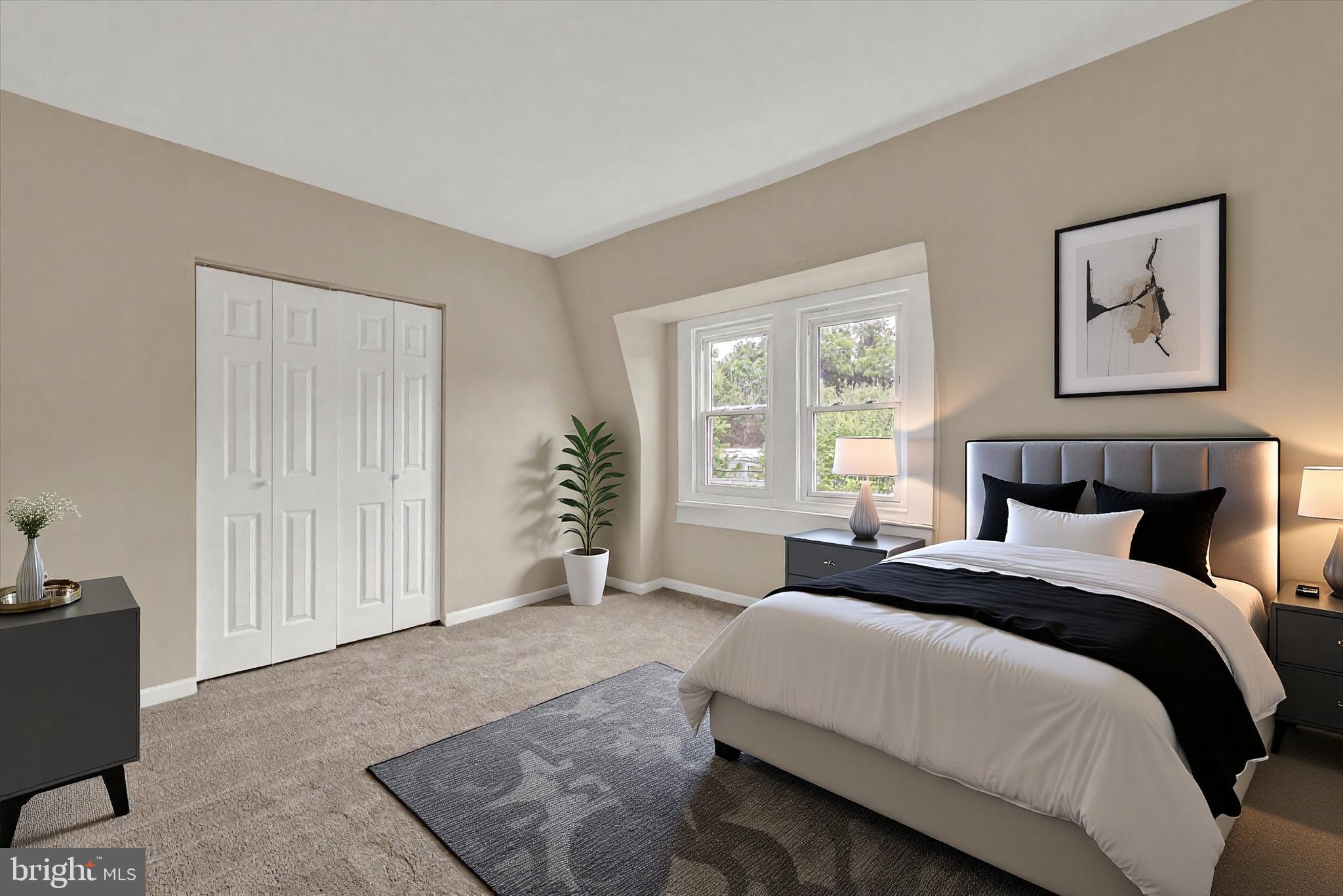 8511 Frederick Road Ellicott City, MD 21043 - Photo 21 of 36 a spacious bedroom with a bed and a window