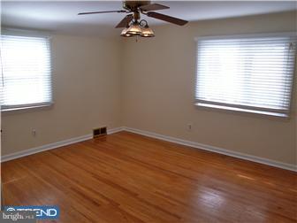 202 Wickford Road Havertown, PA 19083 - Photo 9 of 12 a view of empty room with wooden floor and fan